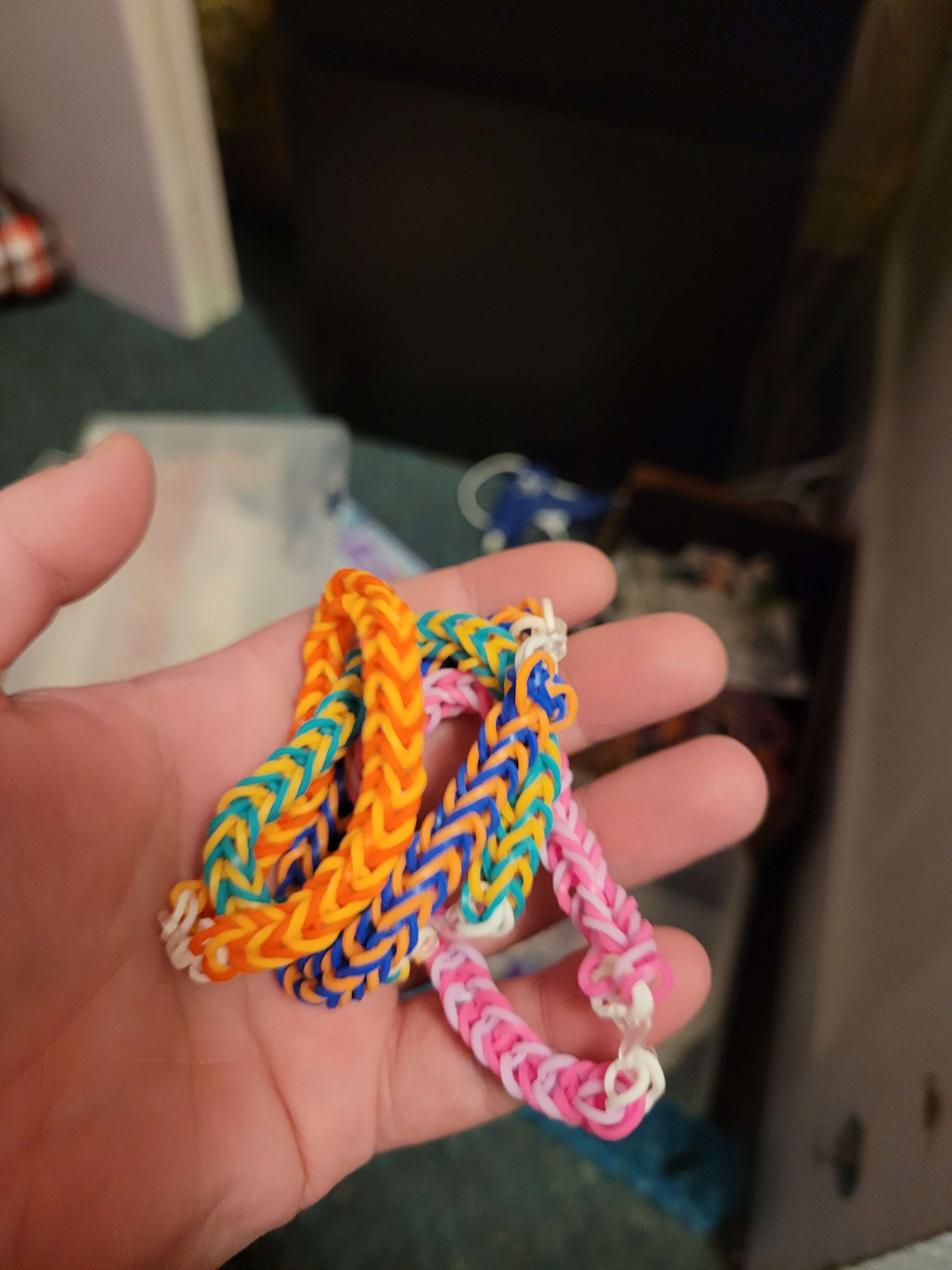 Four colored rainbow loom bracelets