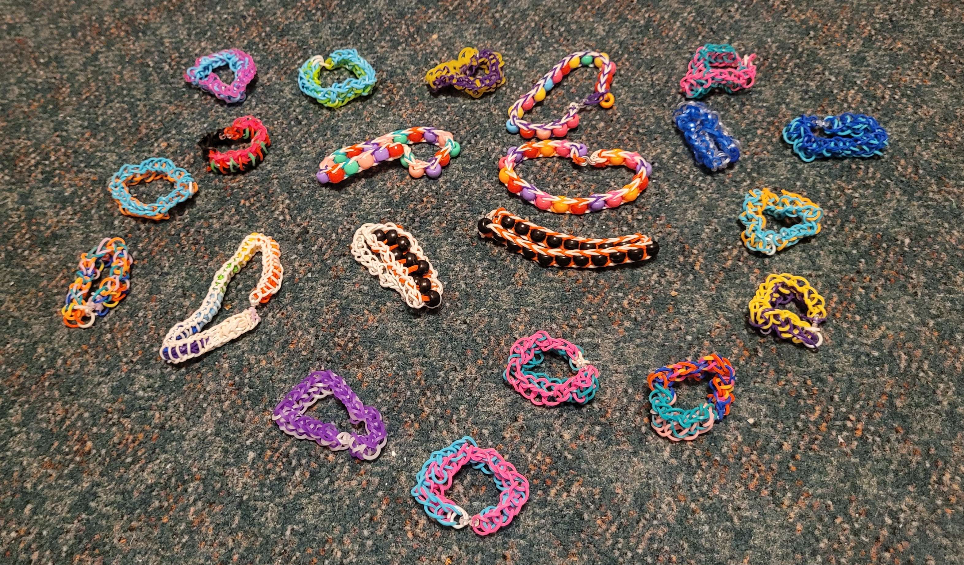 A variety of patterned rainbow loom bracelets.