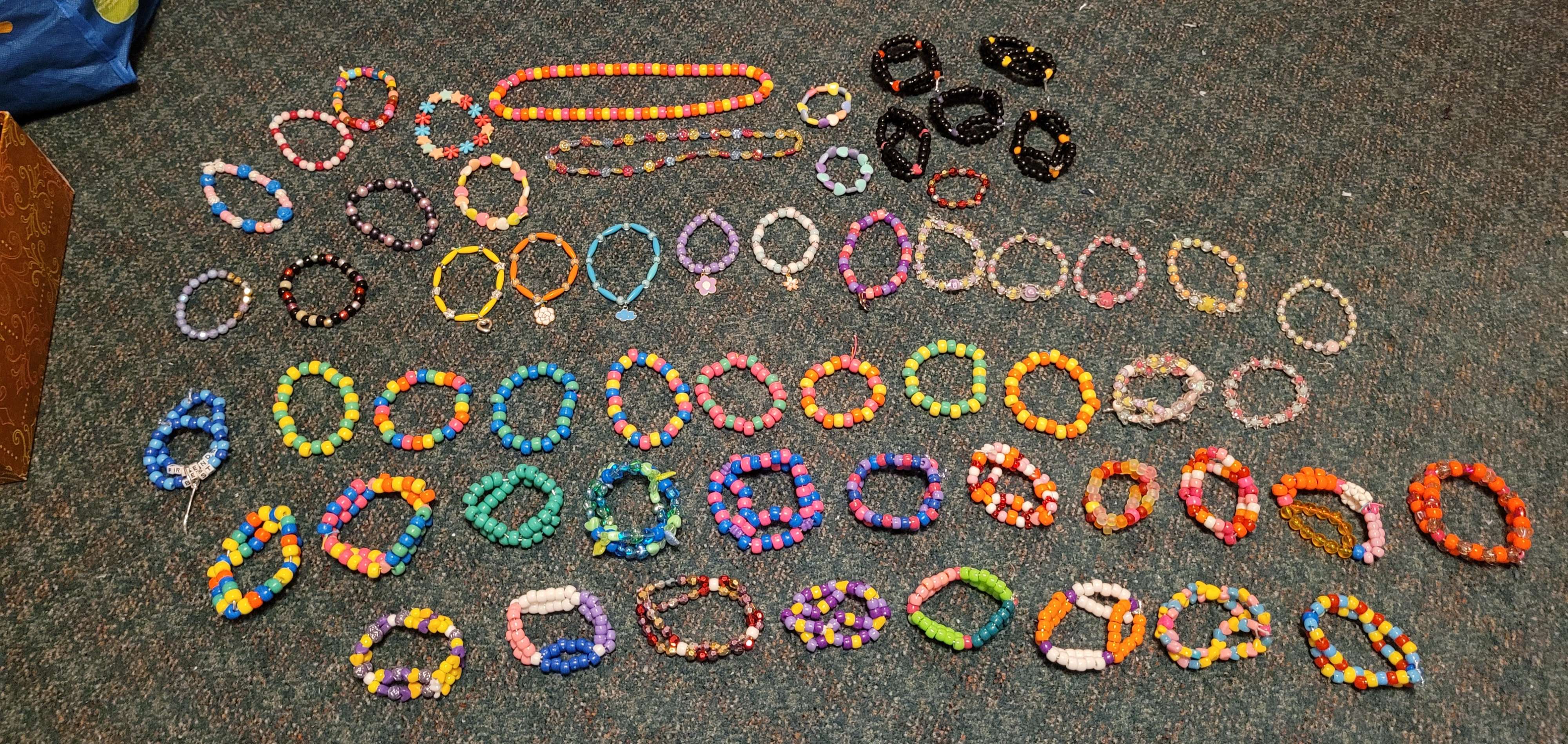 An organized pile of single and double beaded bracelets.