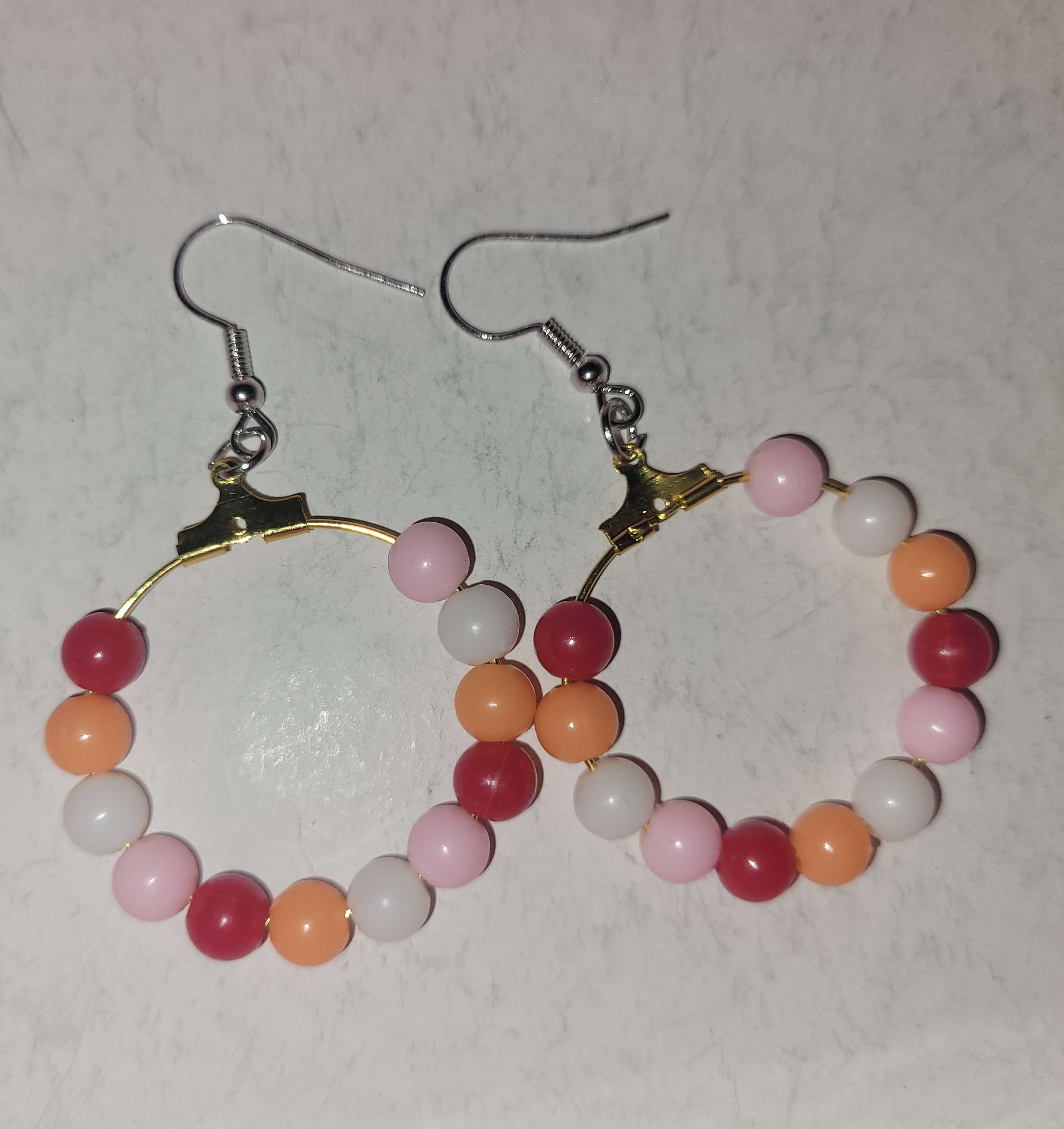 Sunset flag colored beaded hoop earrings.