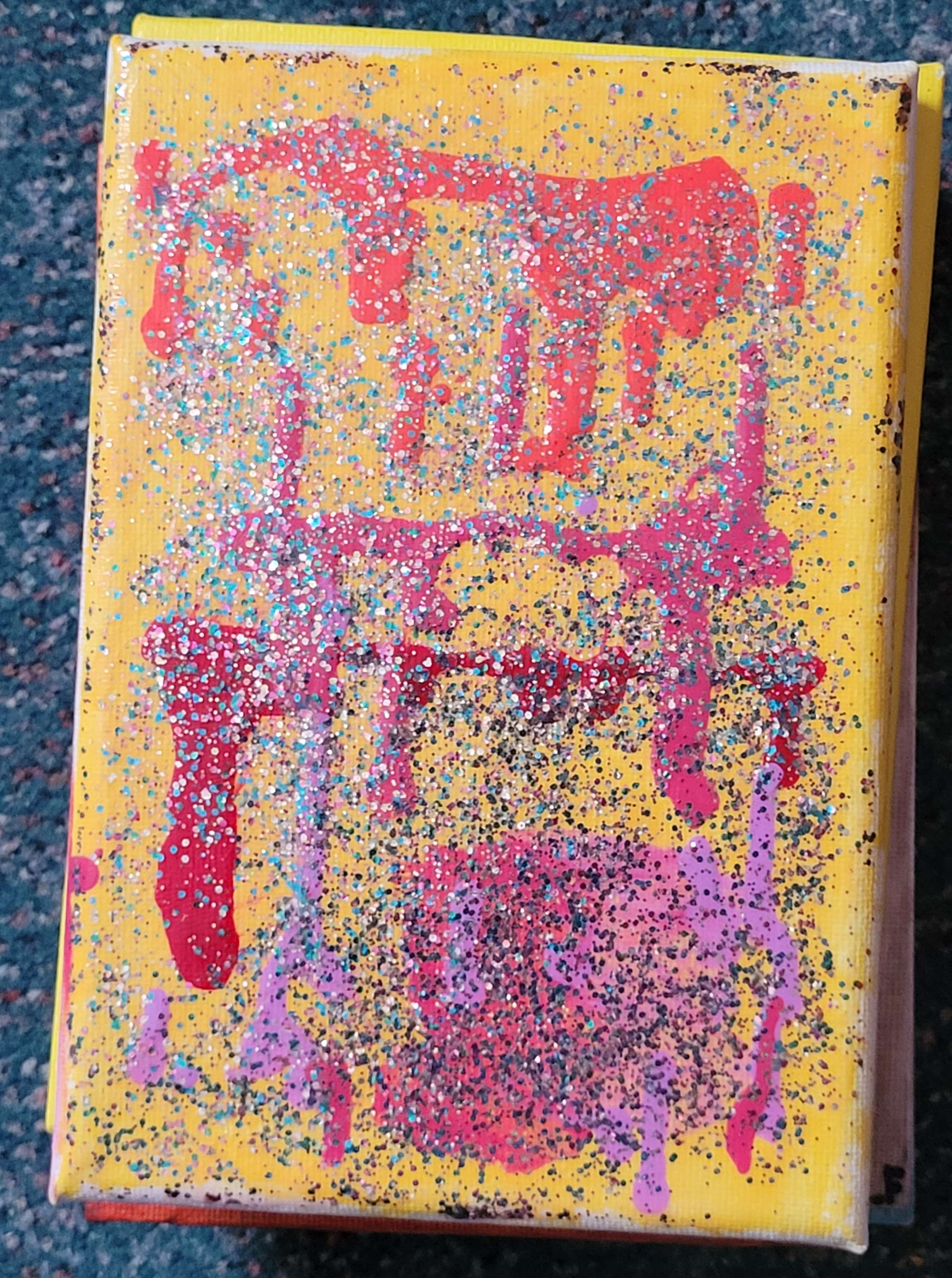 Nail polish on a canvas, its yellow and sparkling.